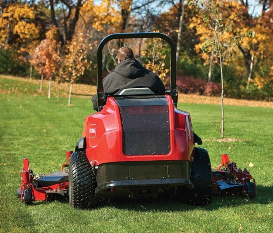 Ride on toro lawn mower cutting grass